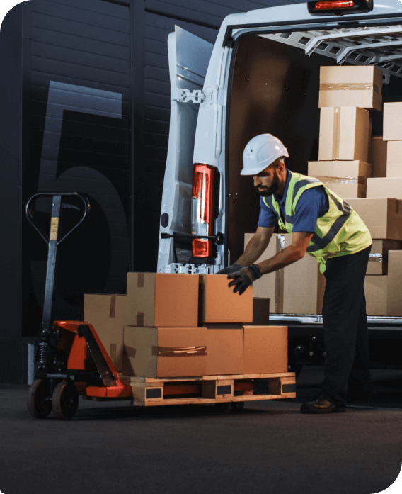 Man putting returned packages on a lift